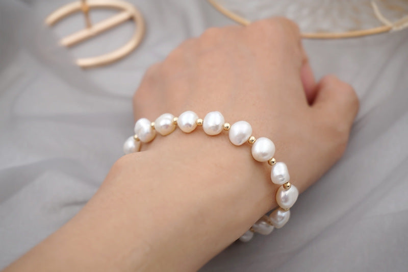PULSERA DE PERLAS CON APLIQUES DE ORO 18K