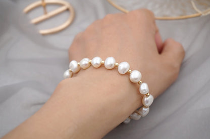 PULSERA DE PERLAS CON APLIQUES DE ORO 18K