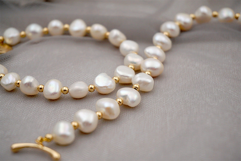 PULSERA DE PERLAS CON APLIQUES DE ORO 18K