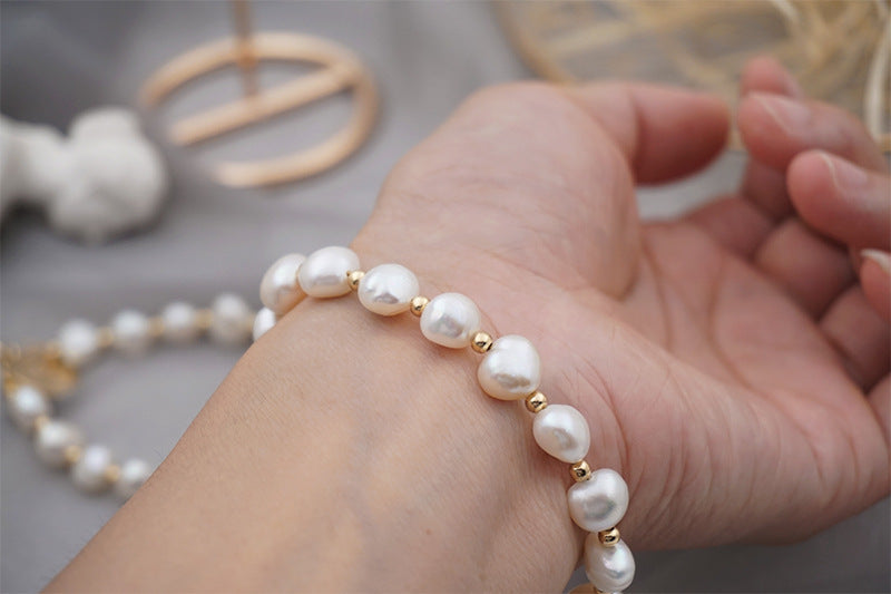 PULSERA DE PERLAS CON APLIQUES DE ORO 18K
